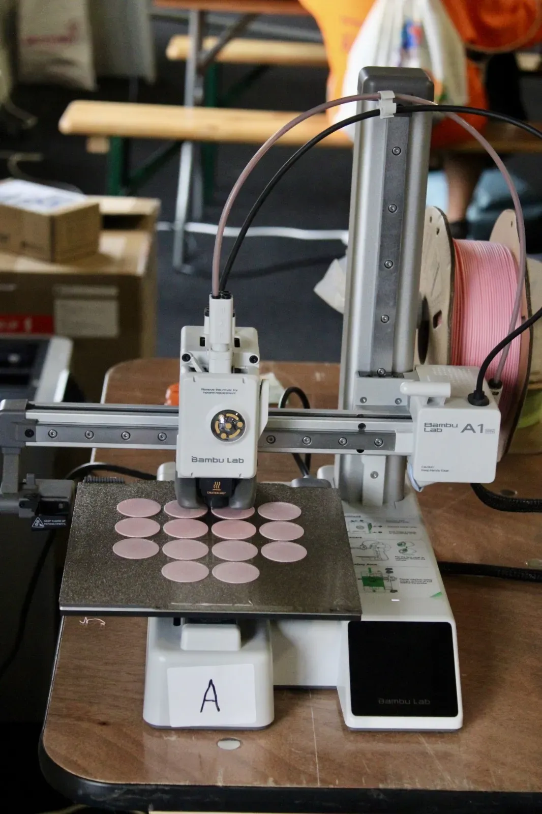 Close-up of a 3D printer laying down filament.